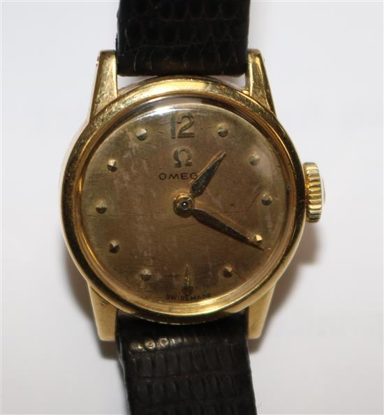 A ladys 1950s 18ct gold Omega manual wind wrist watch.